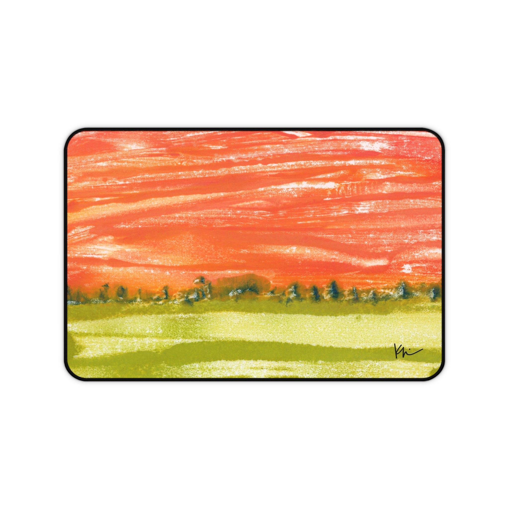 A desk mat with an abstract landscape painting featuring a vibrant sunset-like color palette.