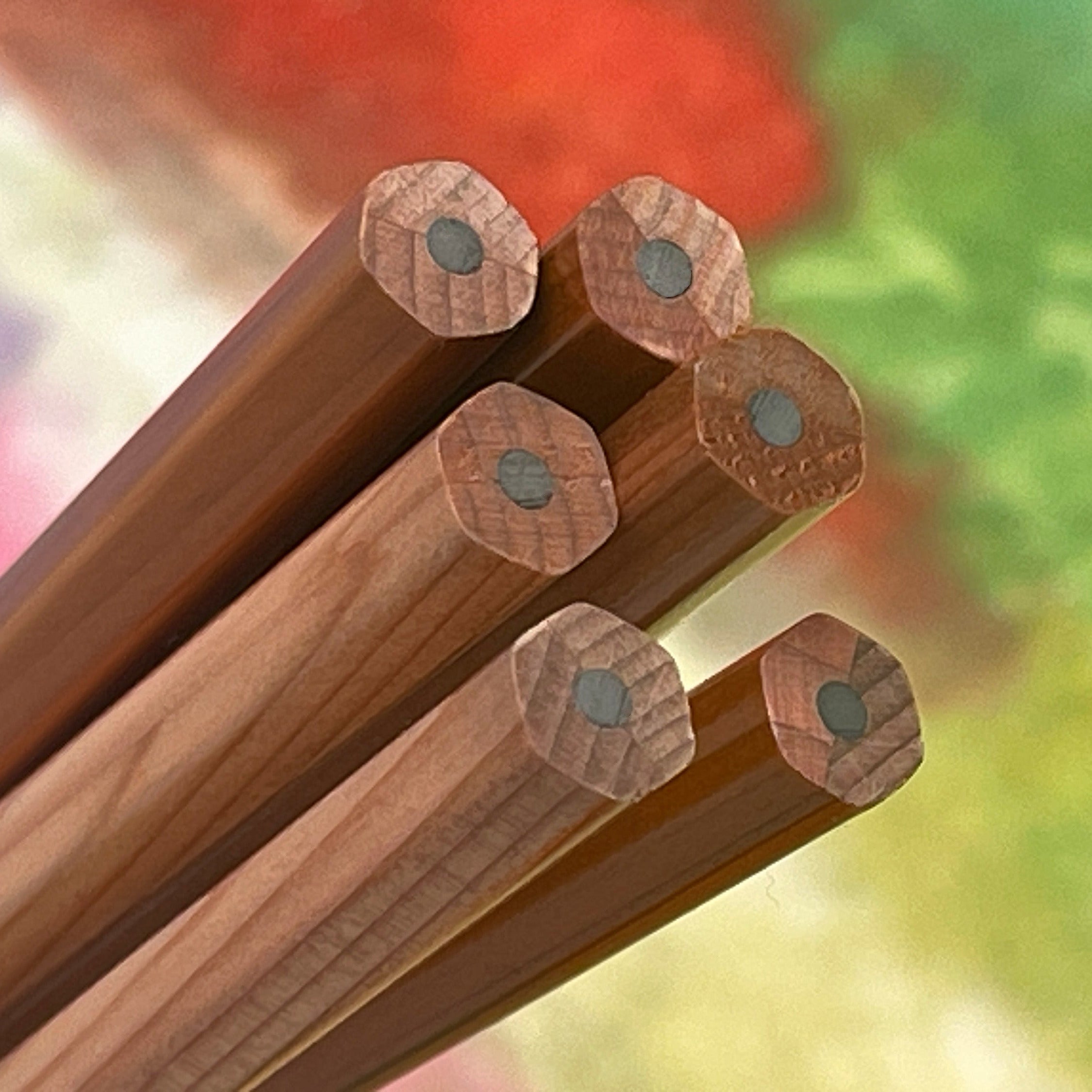 Wooden pencils with wooden caps on a colorful background