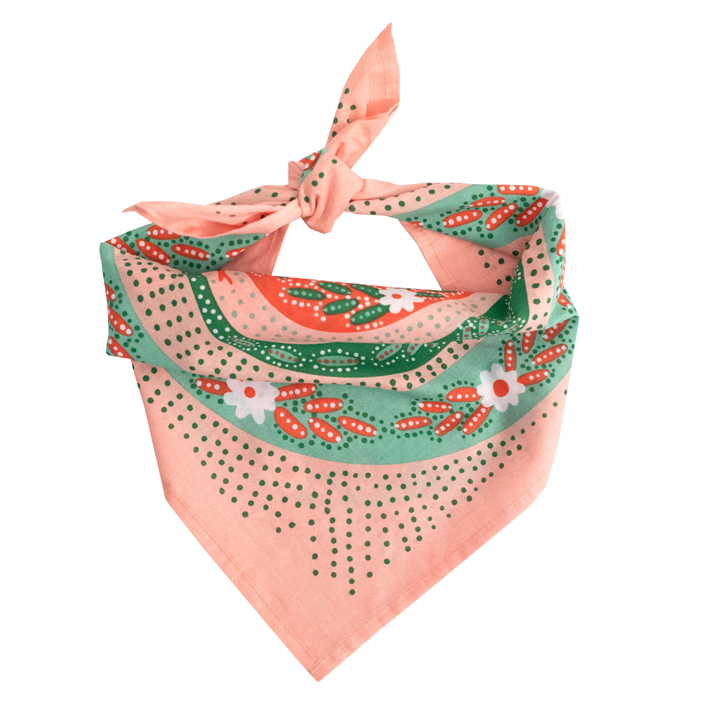 Decorative bandana with floral and polka dot snake patterns on a white background