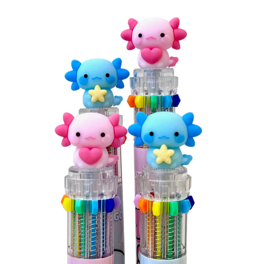 Showing the top details of multi-color click pens with blue and pink axolotl characters on a white background