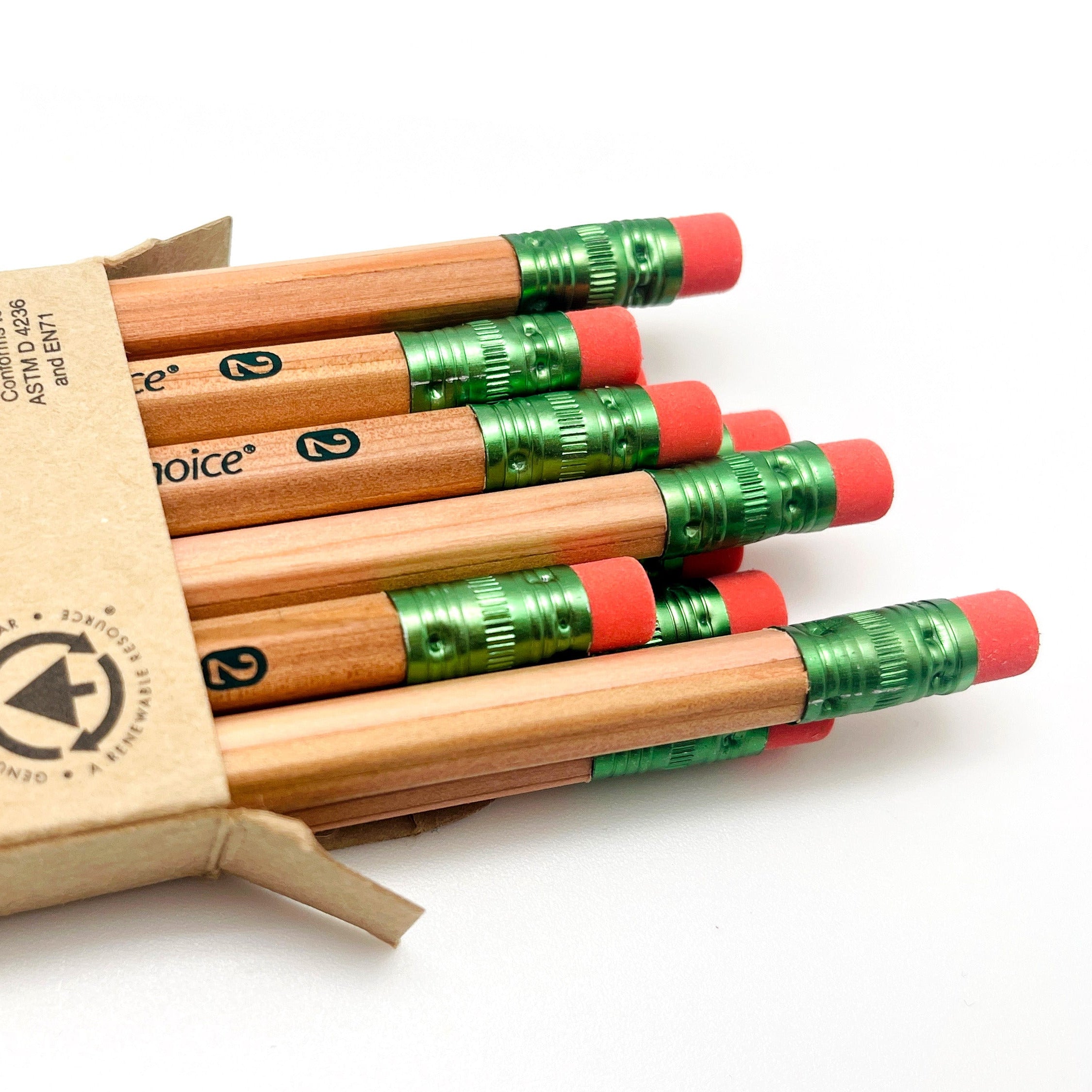 Set of FSC cedar wood pencils in a cardboard box on a white background