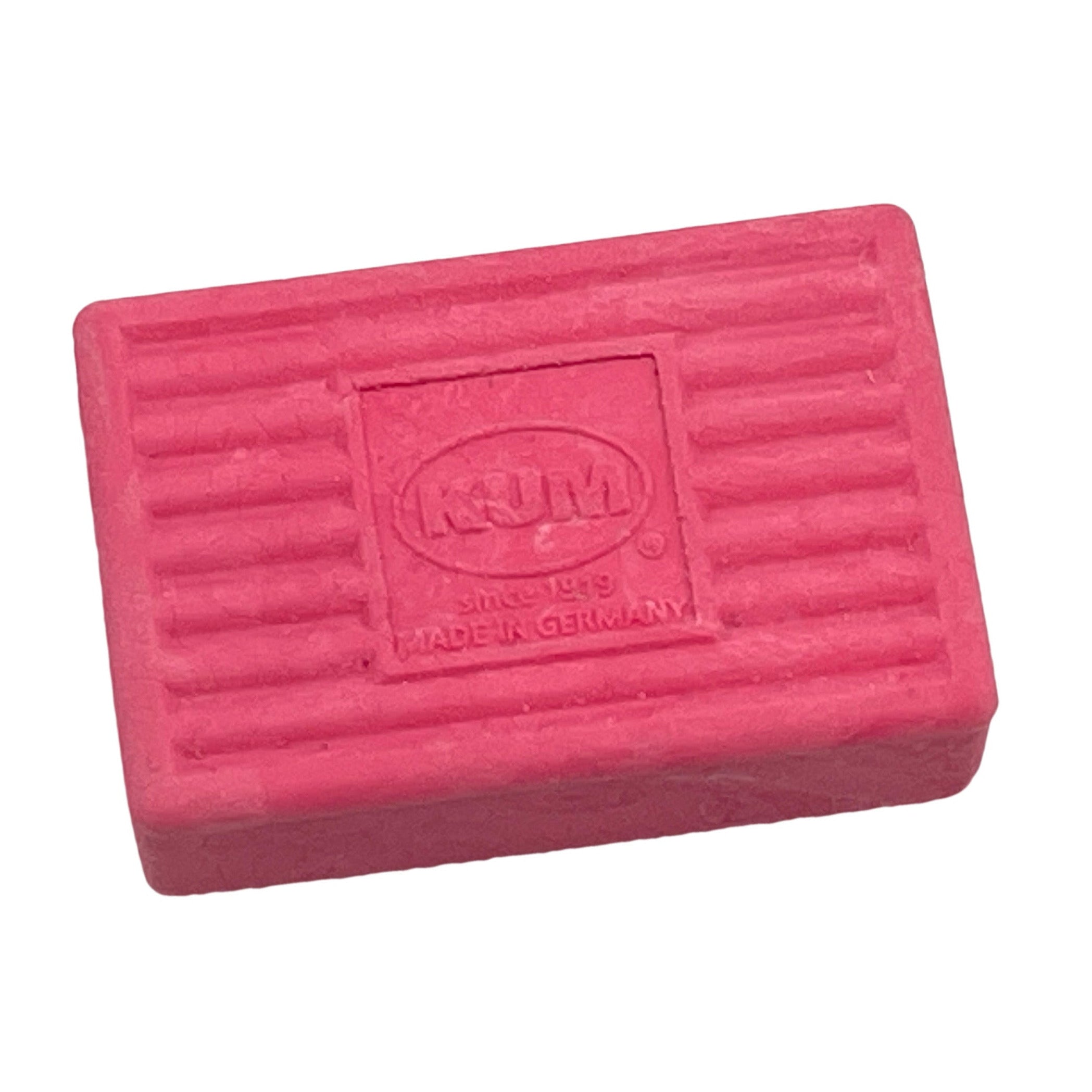 Pink KUM eraser on a white background
