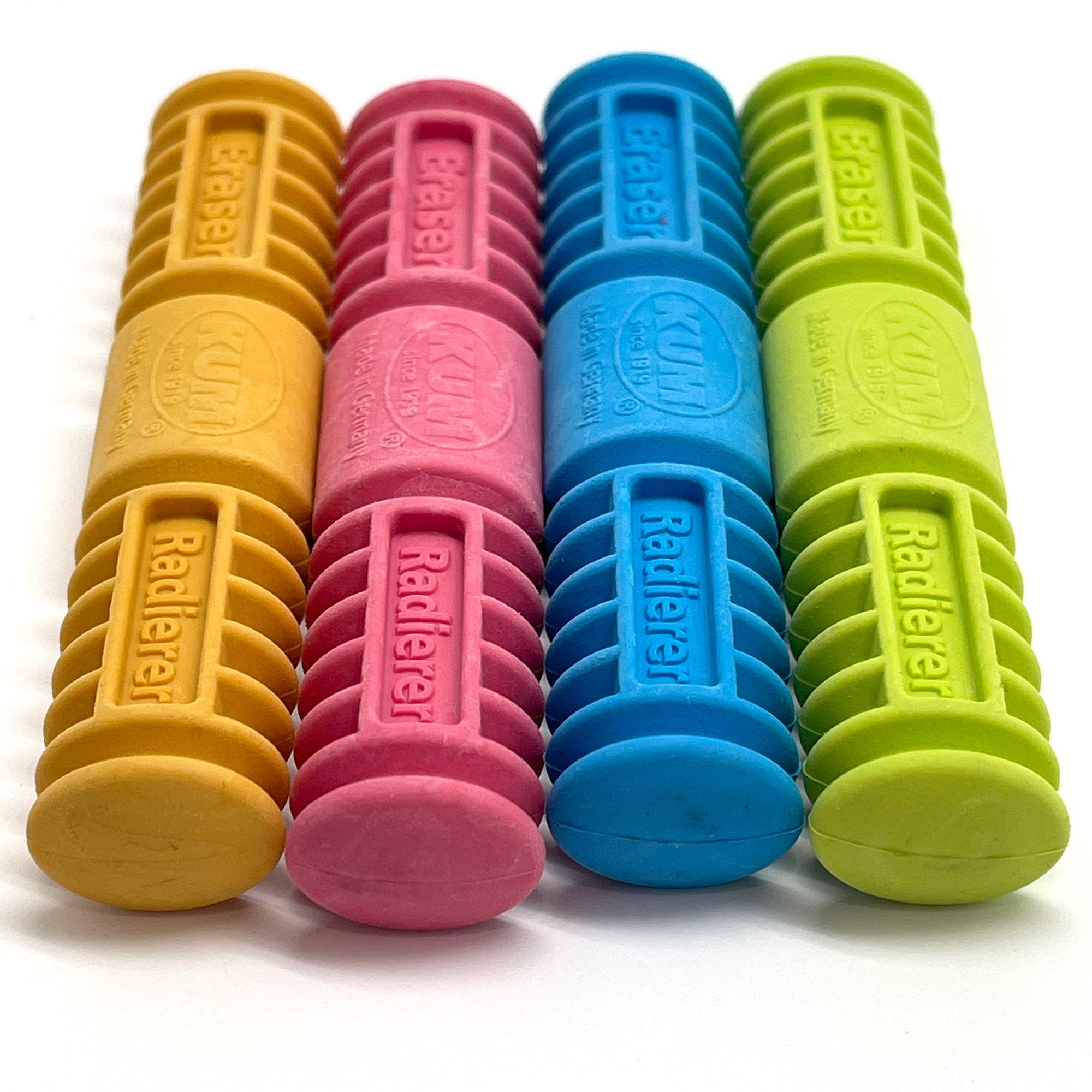 Set of colorful eraser tools in yellow, pink, blue, and green on a white background