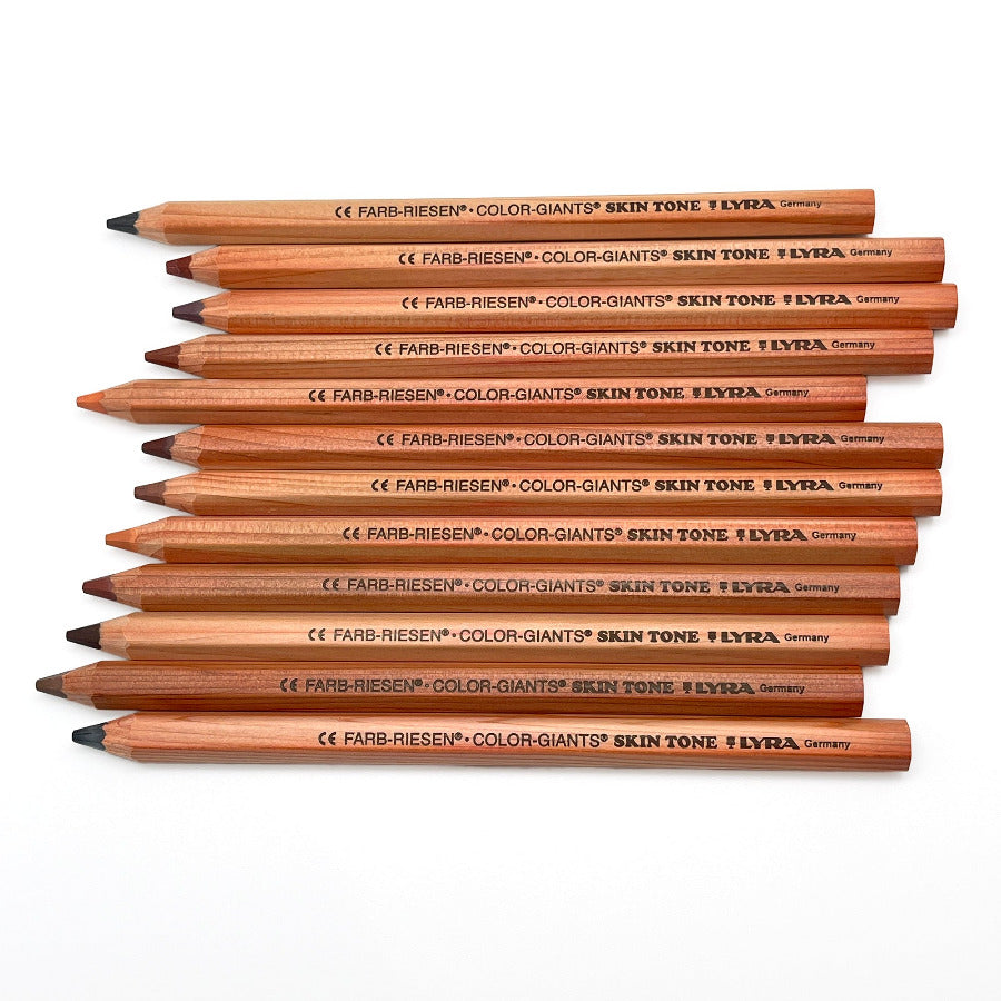 A set of jumbo colored pencils with skin tone colors, displayed on a white surface, with natural wood finish and hexagonal shape.