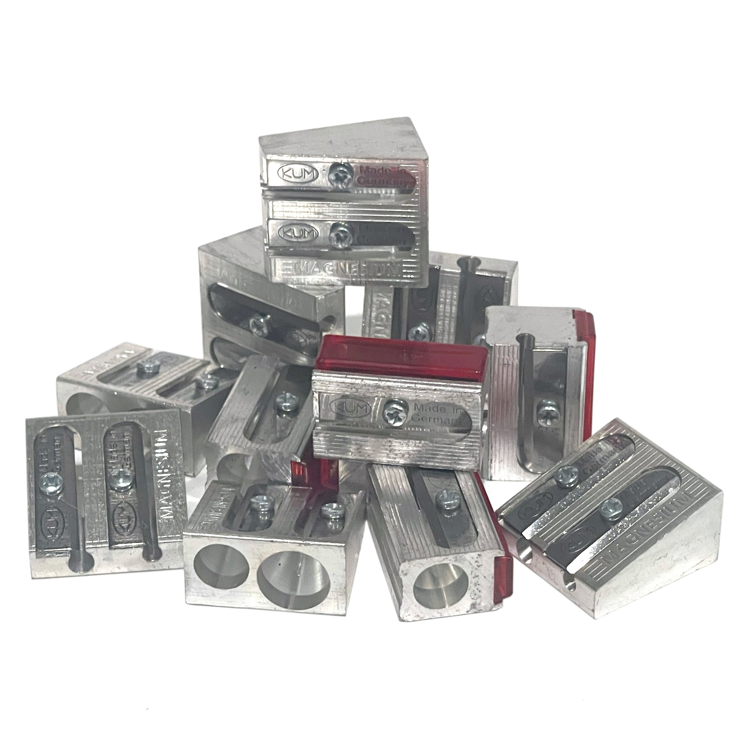 Collection of metal magnesium alloy pencil sharpeners on a white background