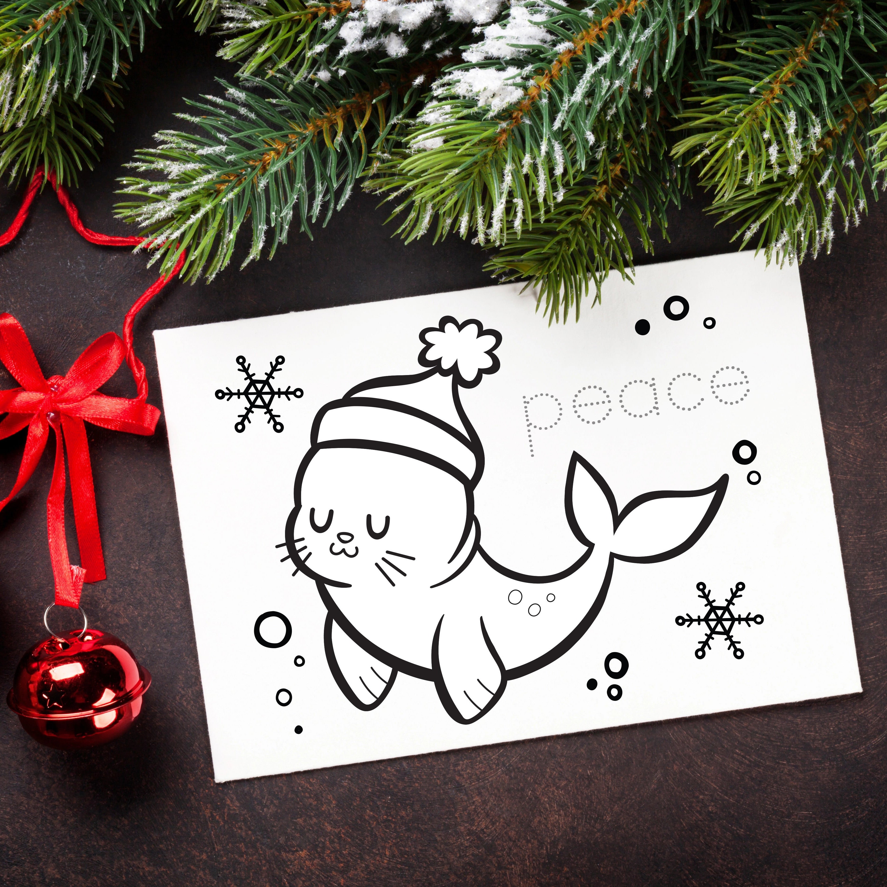 Coloring card to color with a seal wearing a Santa hat and 'peace' text, surrounded by Christmas decorations on a dark surface.