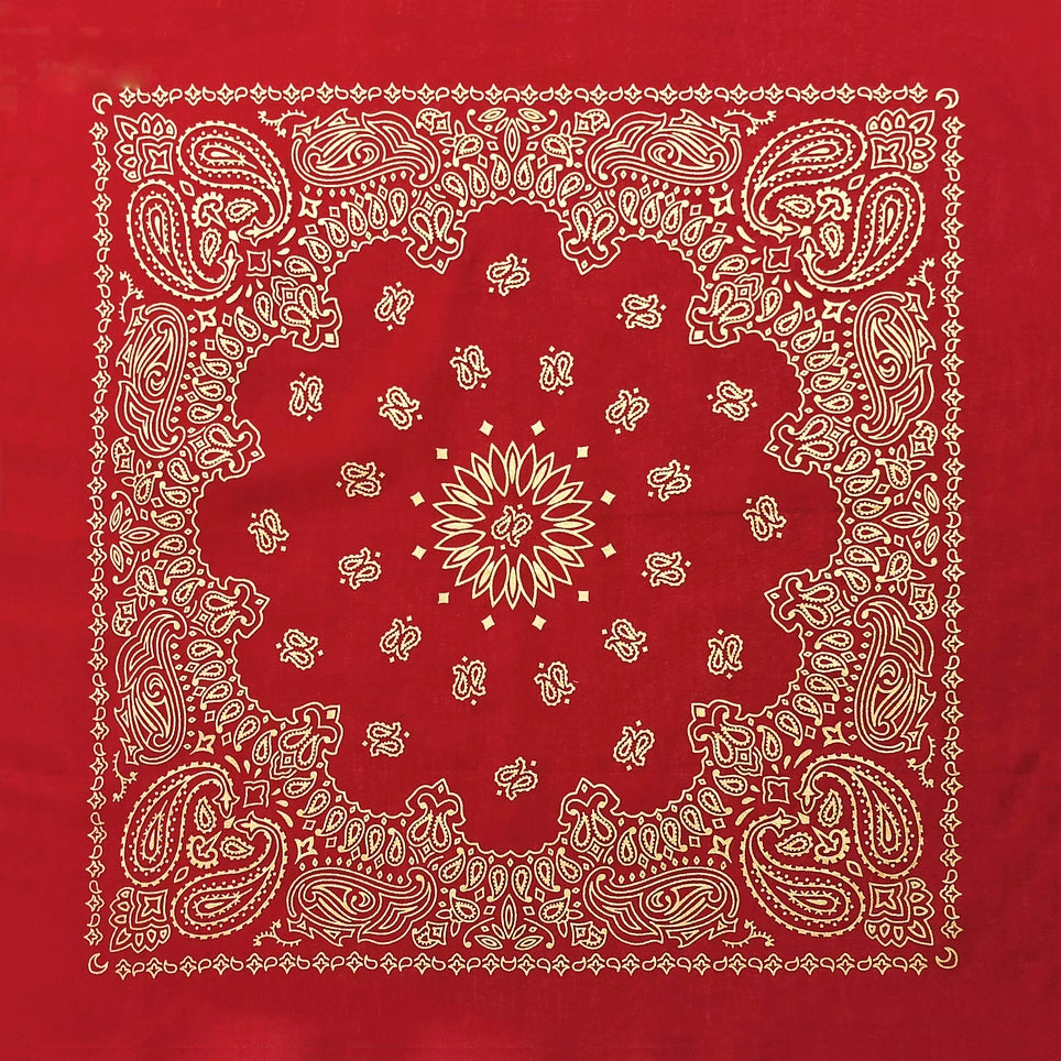 Red cotton bandana with gold paisley pattern on a red background
