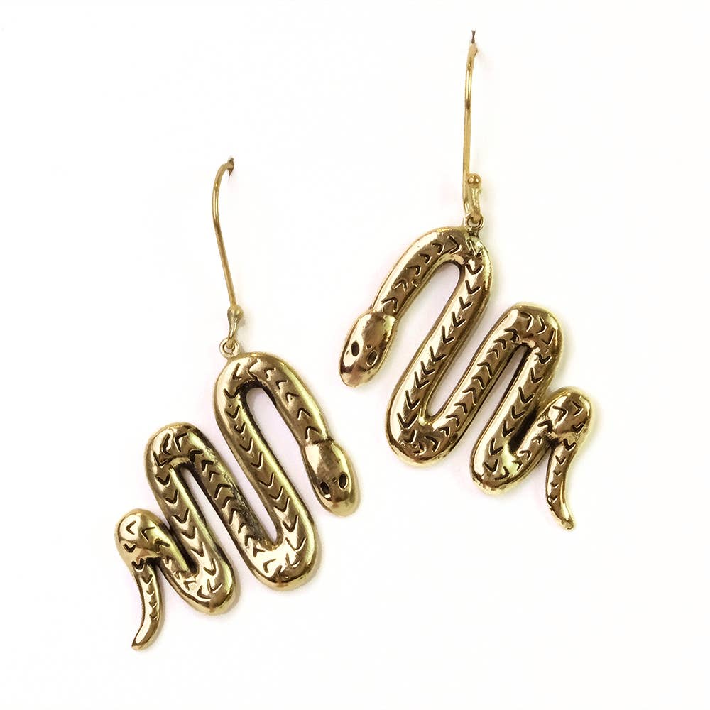 Brass snake-shaped earrings on a white background