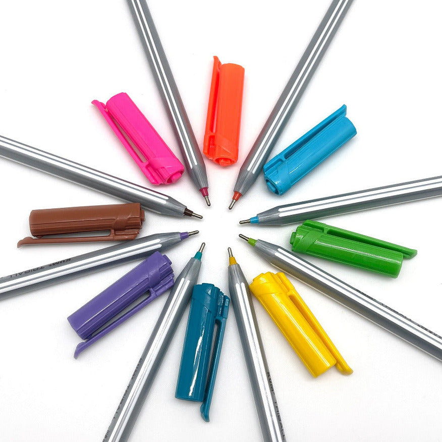 Set of triangular shape colorful rollerball ballpoint pens with their caps on a white background