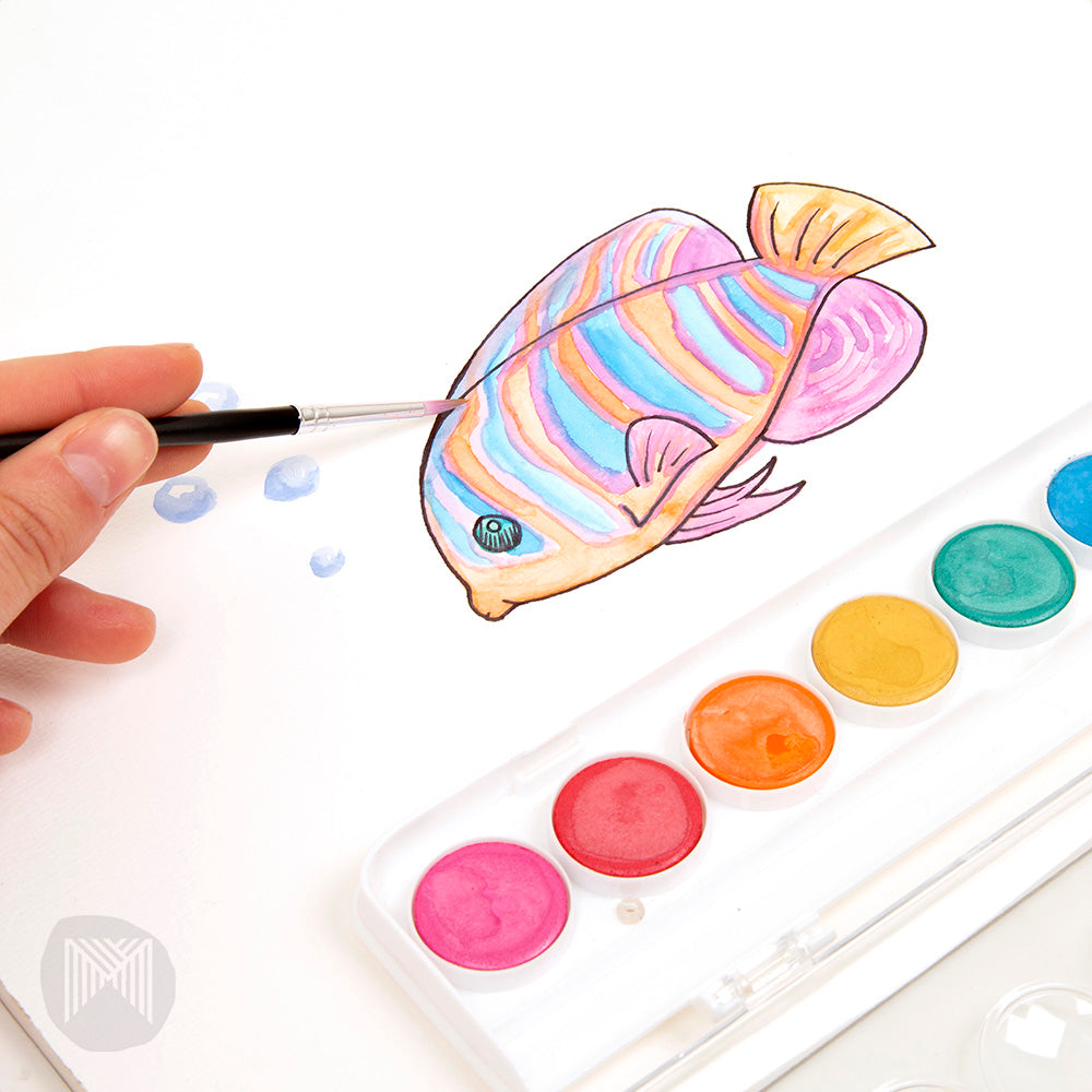 Set of metallic watercolor paints with a fish painting