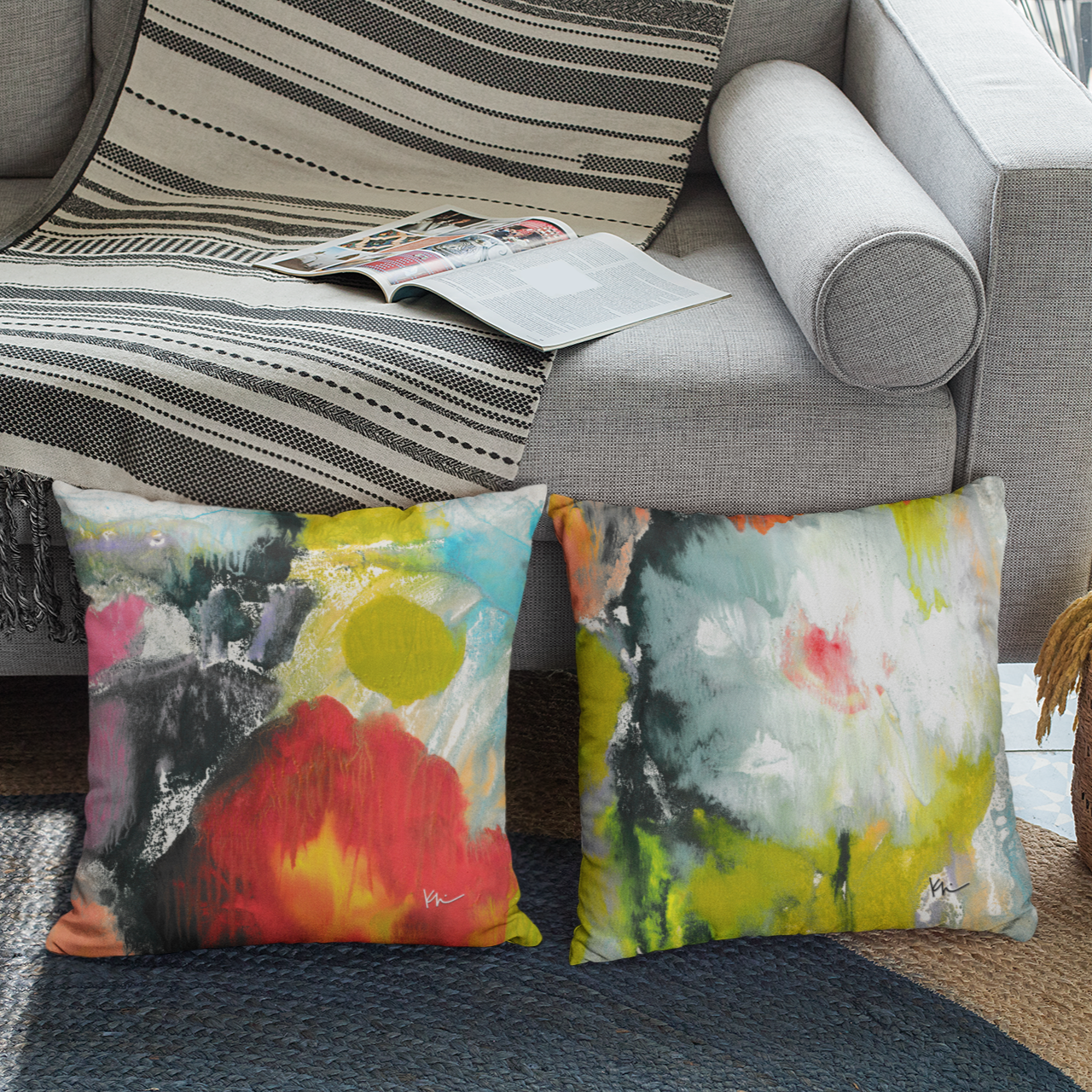 Colorful abstract art pillows on a modern sofa — showcasing human-made home décor and art gifts from Stubby Pencil Studio.