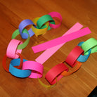 Colorful paper chain on a wooden surface