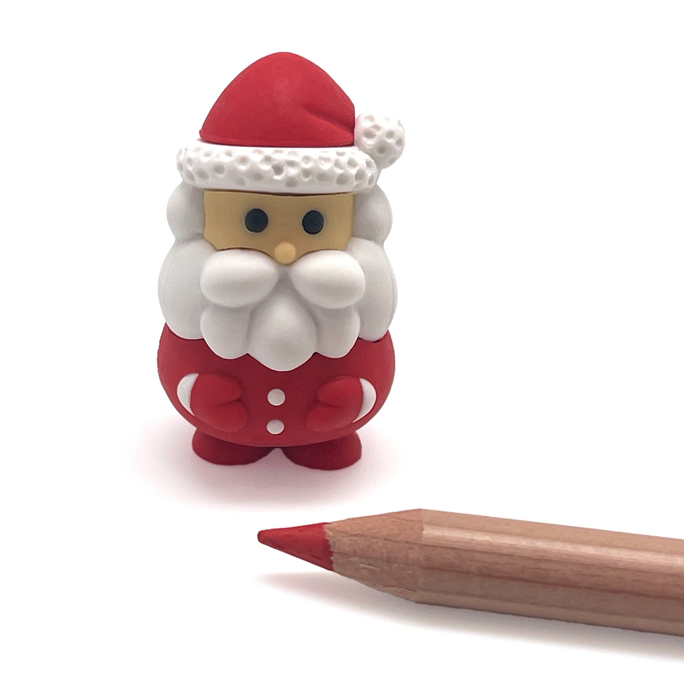 Small Santa Claus puzzle next to a wooden pencil on a white background