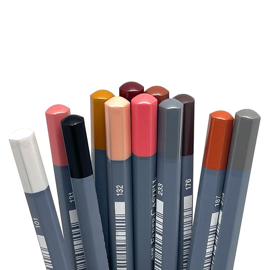 Set of 12 skin tone colored watercolor pencils end tips against a white background
