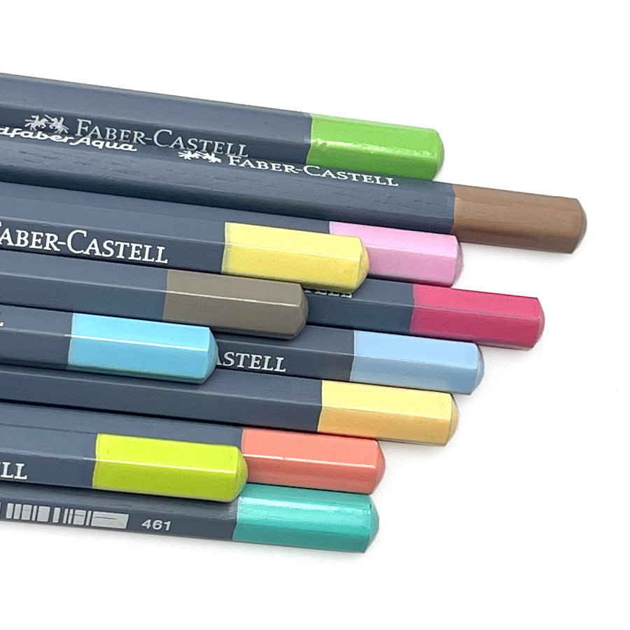 Watercolor pencils with colored pastel tips showing the colors of the pencil leads against white background