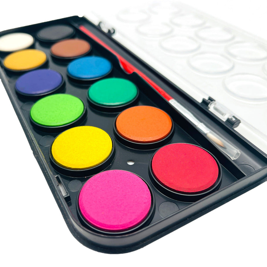 Set of watercolor paints with a brush on a white background