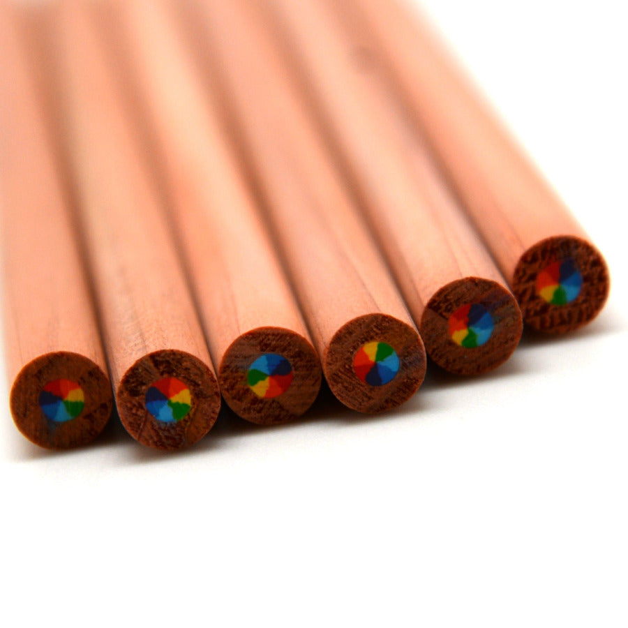 Six wooden pencils arranged in a fan shape on a white background, showing their multi-color rainbow core on the ends.