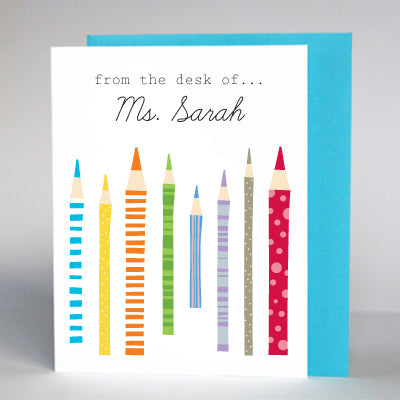 Personalized teacher stationery cards with colorful pencil illustrations and from the desk of... the name 'Ms. Sarah' printed at the top.