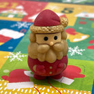 Santa Claus mini eraser on a colorful Christmas Advent Calendar