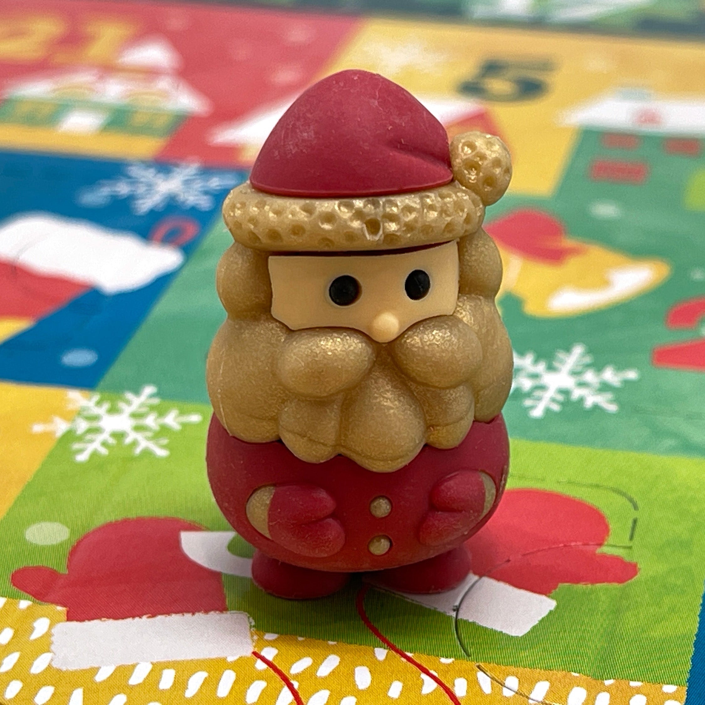 Santa Claus mini eraser on a colorful Christmas Advent Calendar