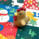 Golden chicken mini eraser on a colorful Christmas Advent Calendar