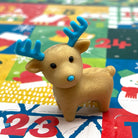 Golden reindeer mini eraser on a colorful Christmas Advent Calendar