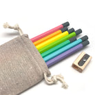 Set of colorful Camel HB Graphite pencils with a wooden sharpener and linen storage pouch on a white background