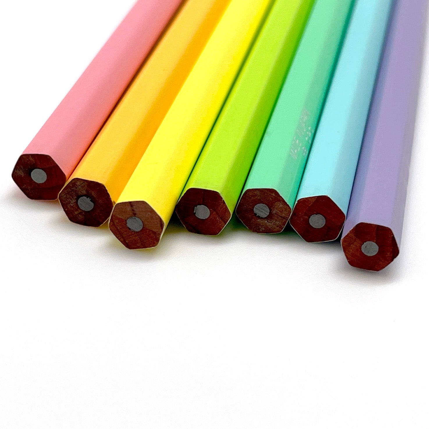 Set of colorful hexagonal Camel graphite pencils on a white background