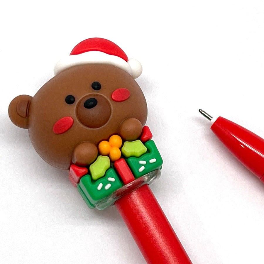 Red gel pen with a Christmas-themed bear on a white background