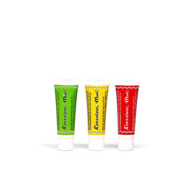 three mini tubes of coccoina mia white glue (green, yellow, red tubes) against a white background
