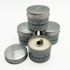 Paste in tin containers stacked against a white background