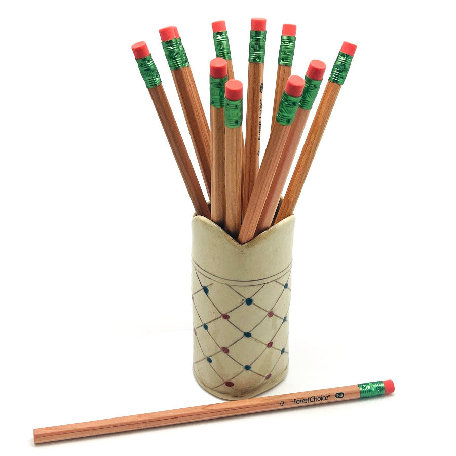 A set of FSC cedar wood pencils with erasers in a decorative holder on a white background