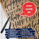 Marker with 'Happy Birthday' text on kraft paper and 'Artist quality ink' label.