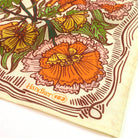 Floral patterned fabric with 'Handker 153' branding on a white background