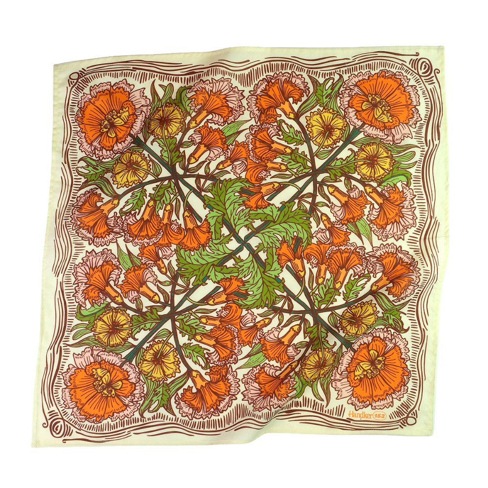 Floral patterned cotton bandana scarf with orange, green, and yellow flowers on a cream background
