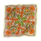 Floral patterned cotton bandana scarf with orange, green, and yellow flowers on a cream background