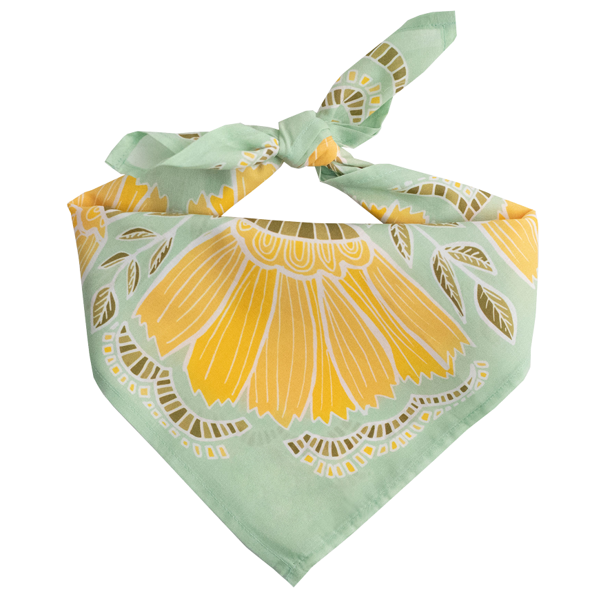 Green and yellow flower patterned cotton bandana on a white background