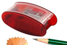 Red pencil sharpener with a pencil and pencil shavings on a white background