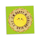 Sketchbook with a smiley face and text 'I'm happy and feeling glad' on a green background