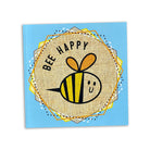 Sketchbook with a bee illustration and 'Bee Happy' text on a blue background