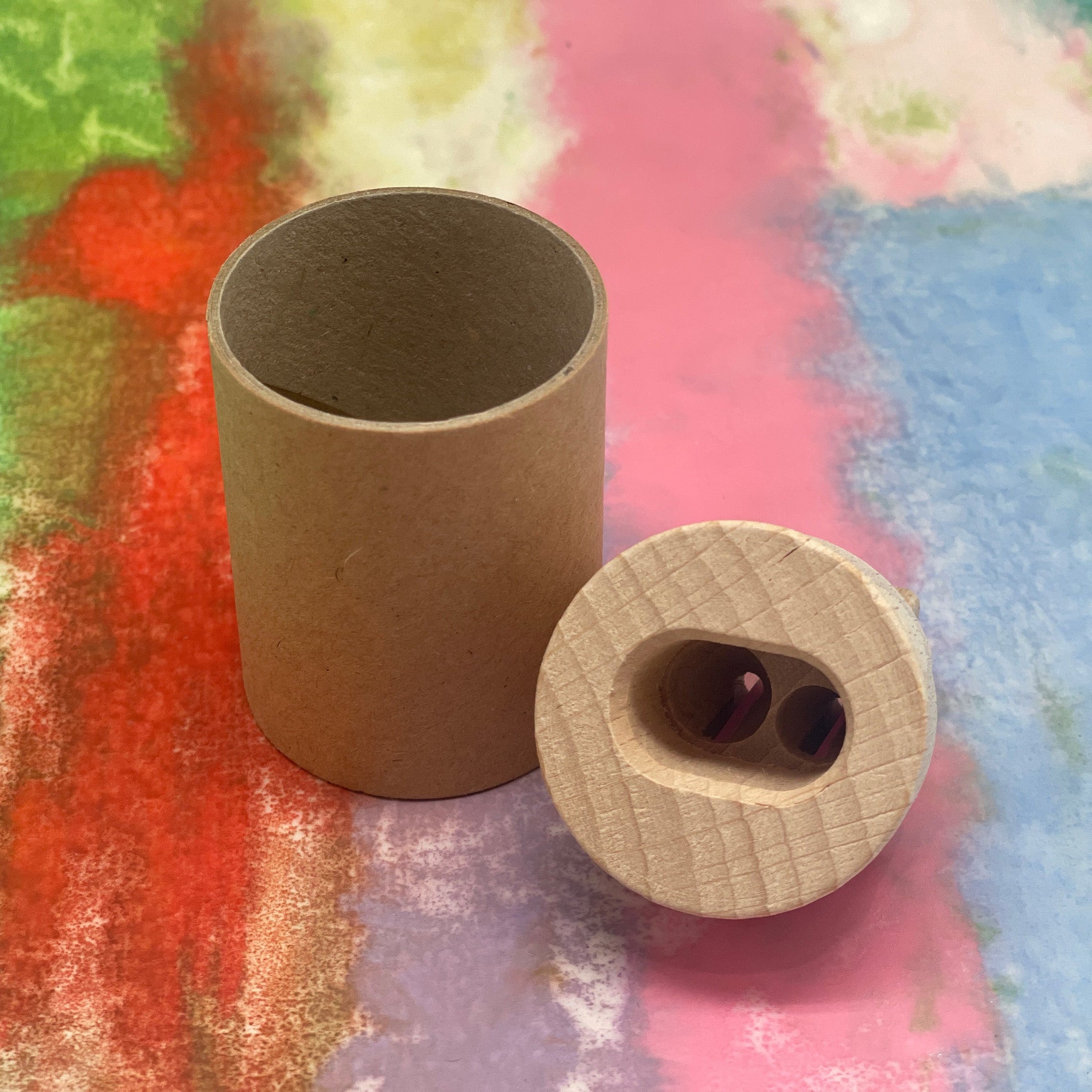 Recycled cardboard canister pencil sharpener with wooden top and 2 holes for standard and jumbo pencil sharpening