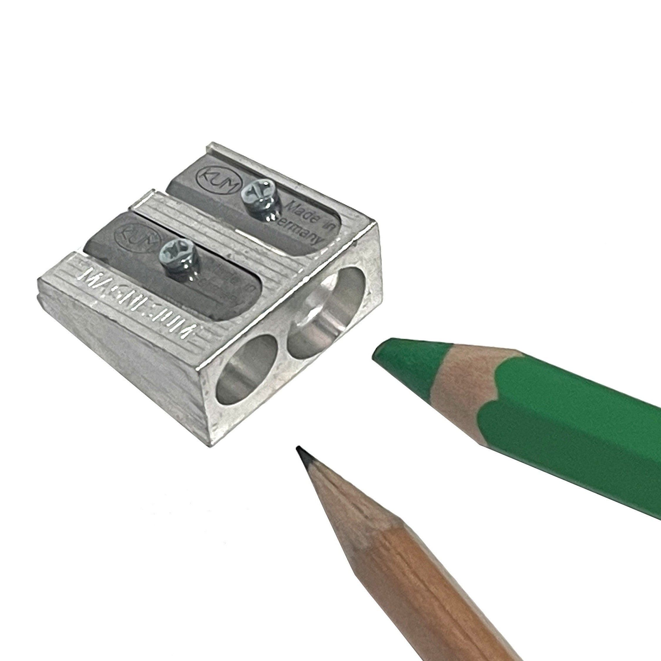 Metal pencil sharpener with two sharpened pencils on a white background