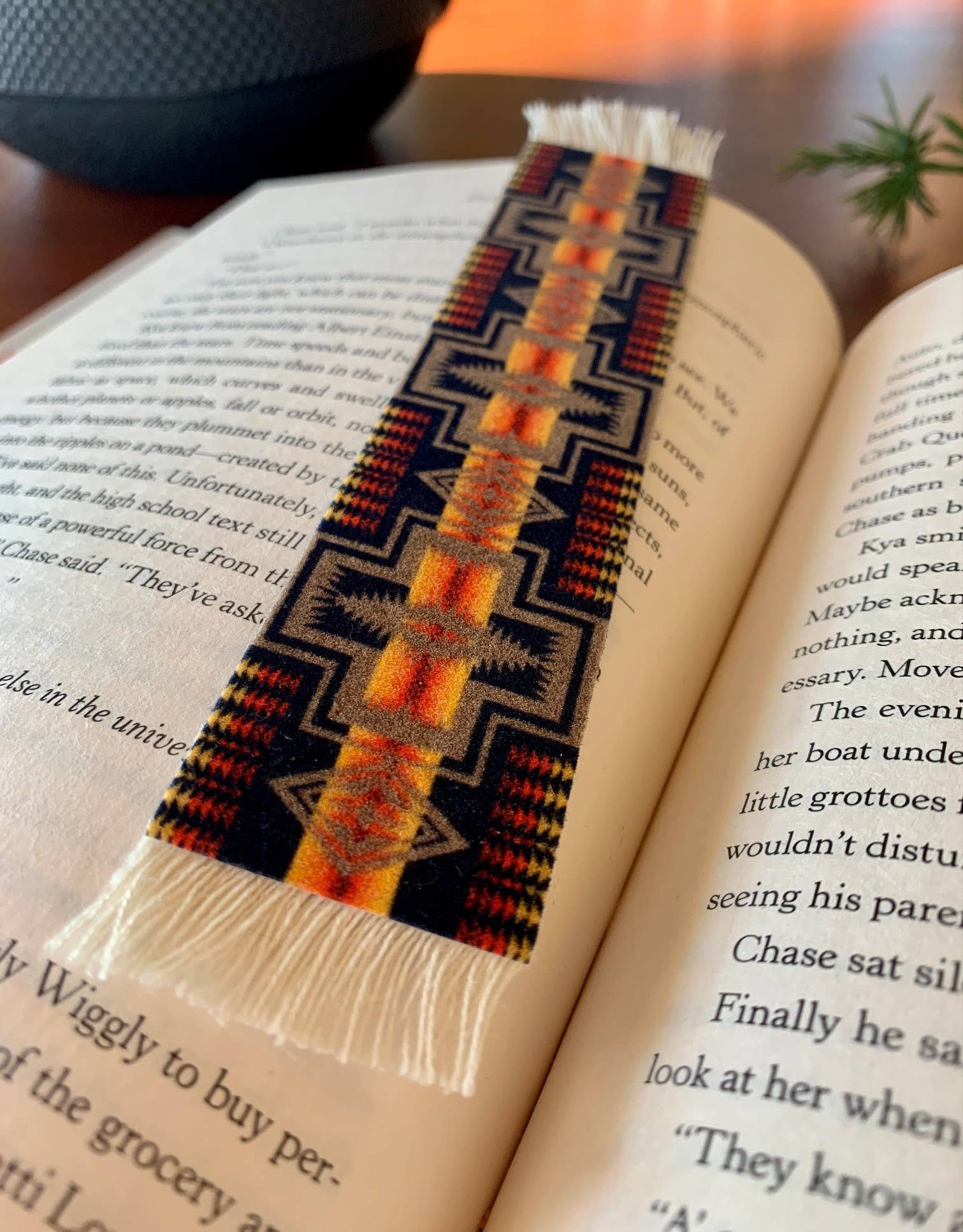 Textile bookmark with geometric pattern on an open book