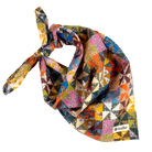 A multicolor Calico geometric-patterned bandana tied in a knot, featuring a patchwork design of triangles and squares in orange, blue, pink, yellow, green, and brown. A small white brand label reading 'Handker' is visible in the bottom right corner, set against a clean white background.