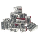 Collection of small pencil sharpeners made from metal magnesium alloy on a white background