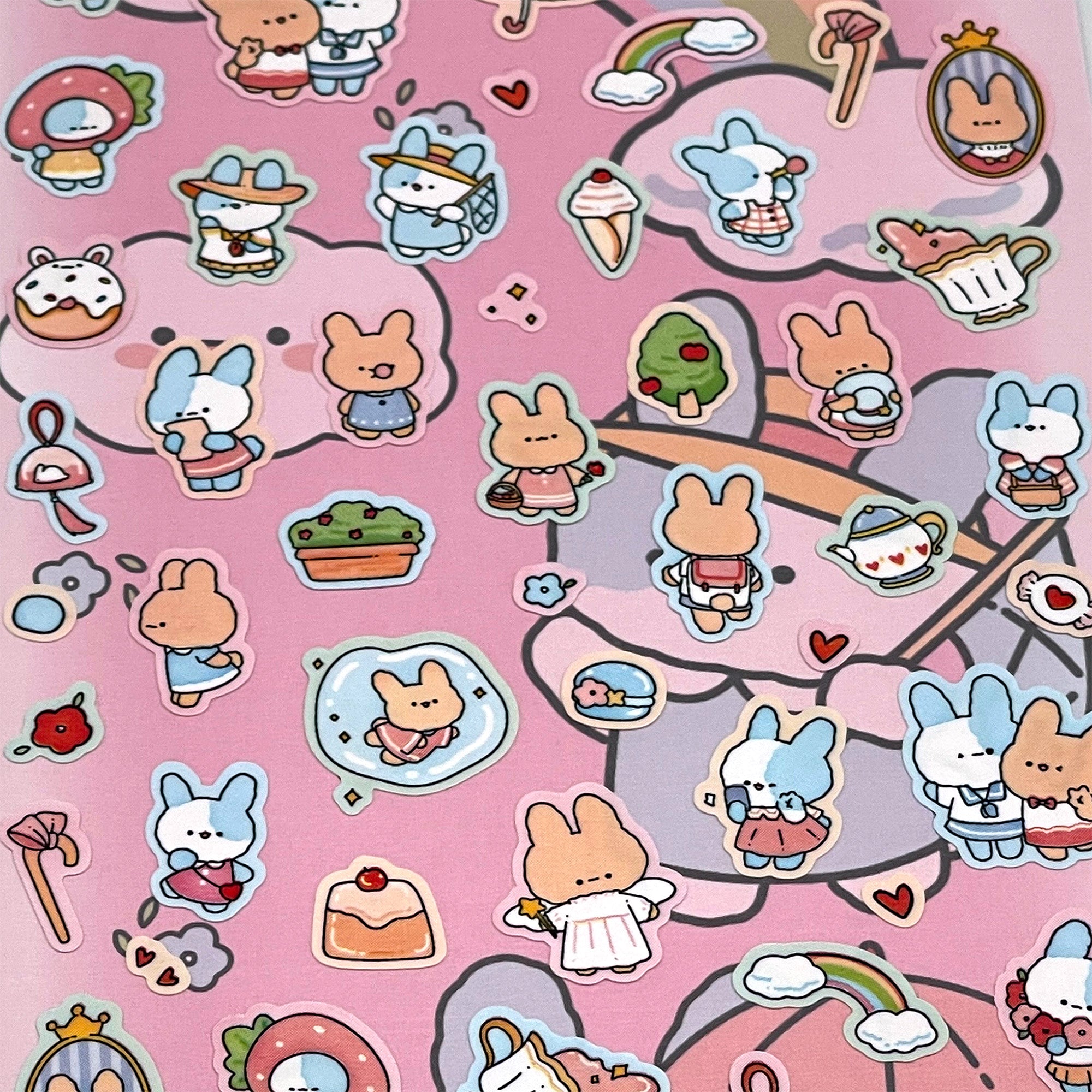 A sheet of various bunny rabbit stickers on a pink background, including different designs of bunnies in clothing and accessories.
