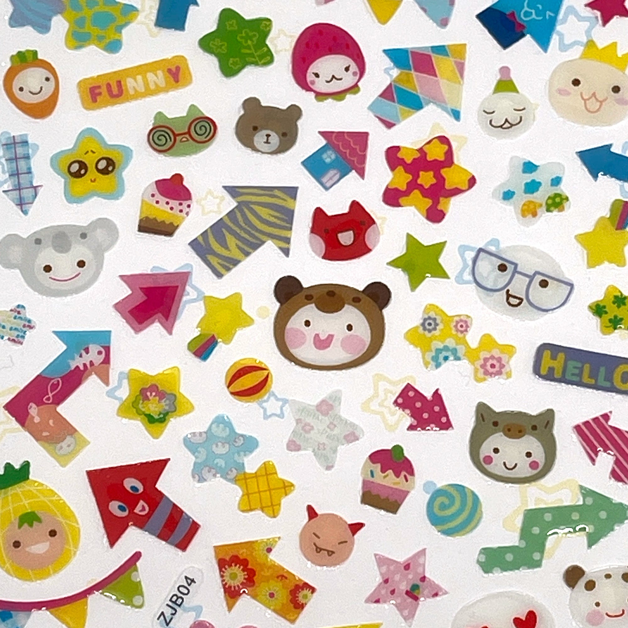 A variety of colorful stickers including animal faces, geometric shapes, and other adorable designs spread out on a surface.