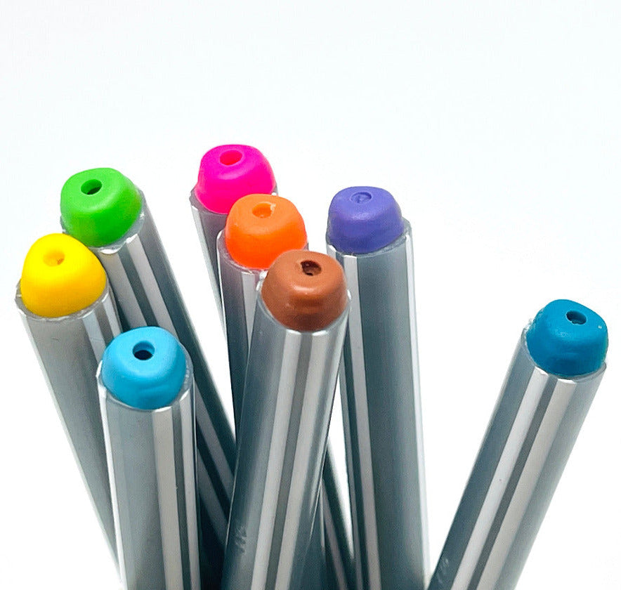 Set of triangular shape colorful rollerball ballpoint pens caps on a white background