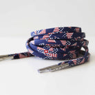 Navy blue shoelaces with American flag pinwheel pattern on a white background