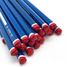 A close-up of several triangular pencils with red end caps and white bands, arranged diagonally on a white background. One pencil shows the text 'CE SPAIN HB'.